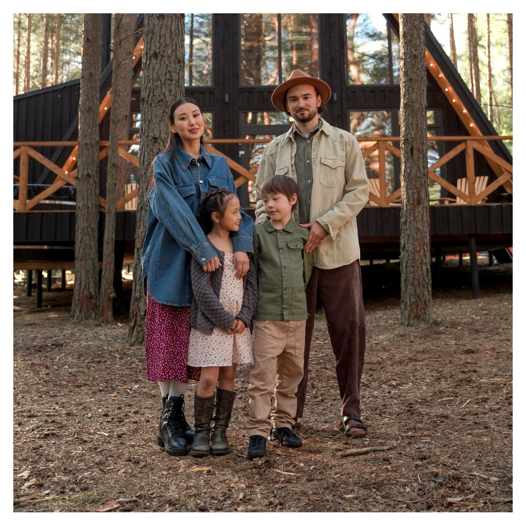 family outside of a cabin