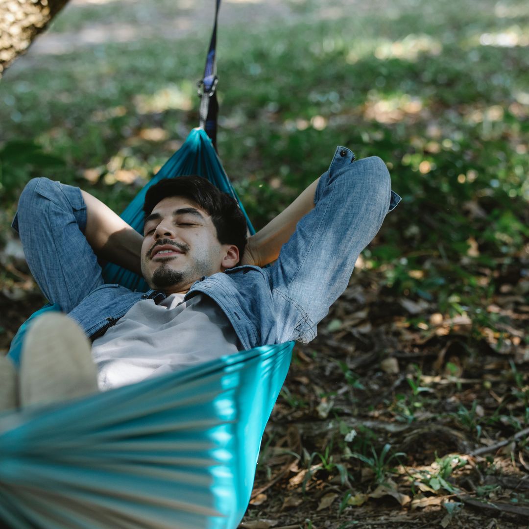 Man lays in hammock