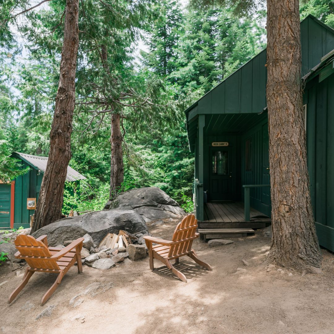 small rustic cabin with fire pit and seating area